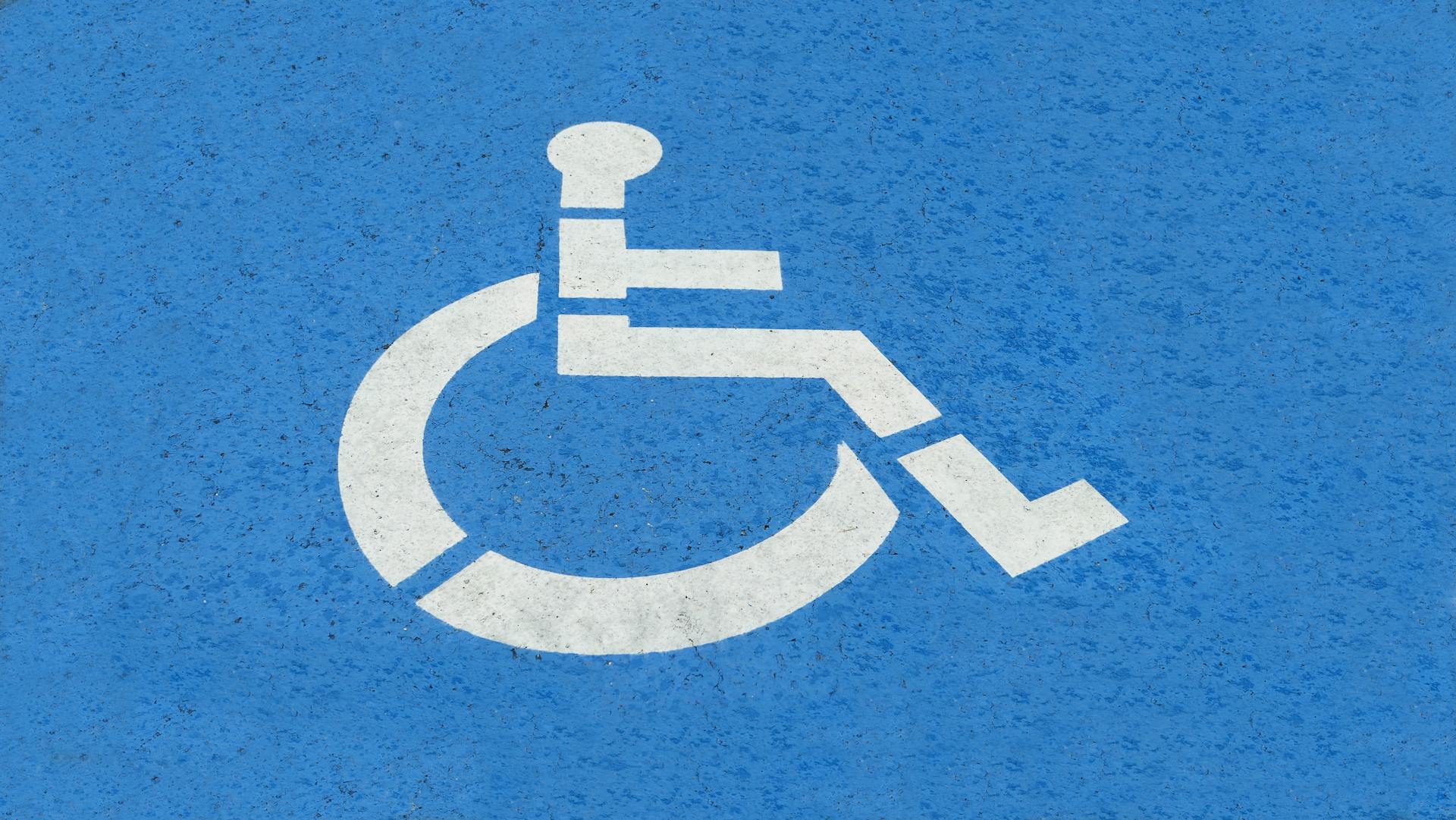 Handicap Sign on Blue Surface