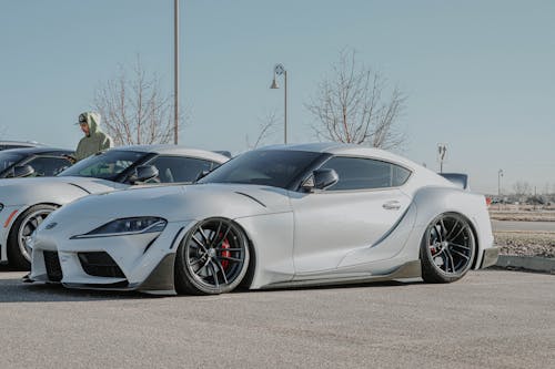 Silver Car Parked on Gray Pavement