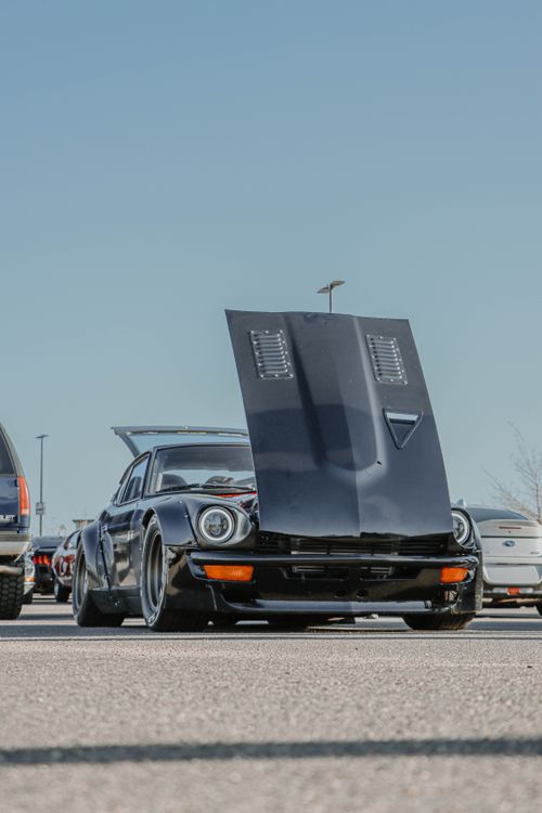 Free Classic Datsun 240Z with hood open at a Denver car show, showcasing its vintage design. Stock Photo