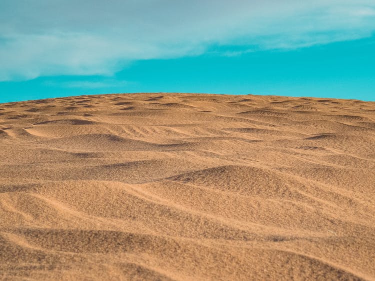 Sand Dunes Under Blue Sky