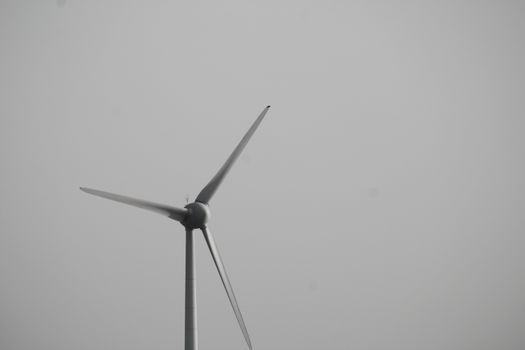 White Wind Turbine Under White Sky