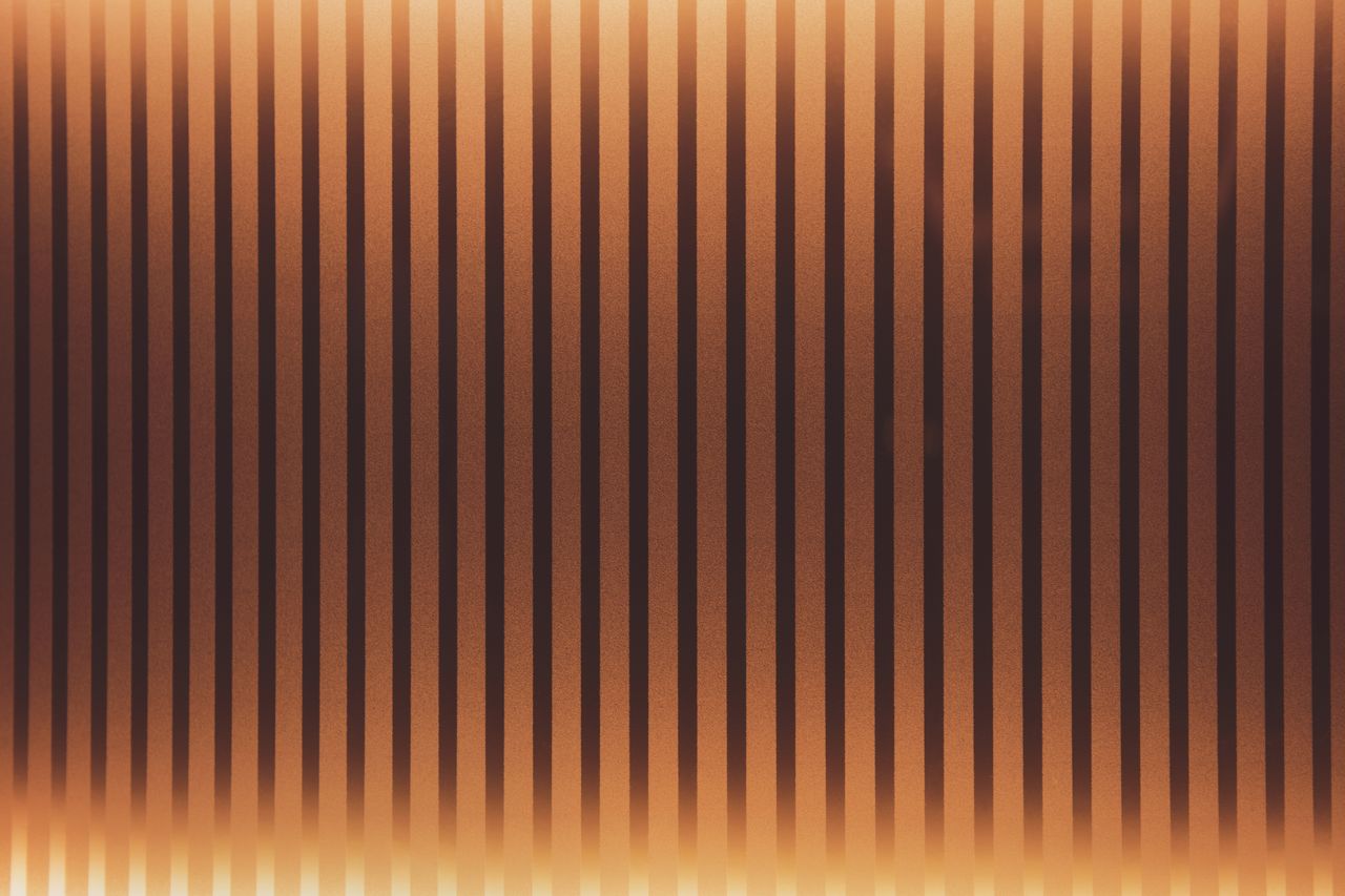 abstract warm toned retro striped wallpaper for design and decoration
