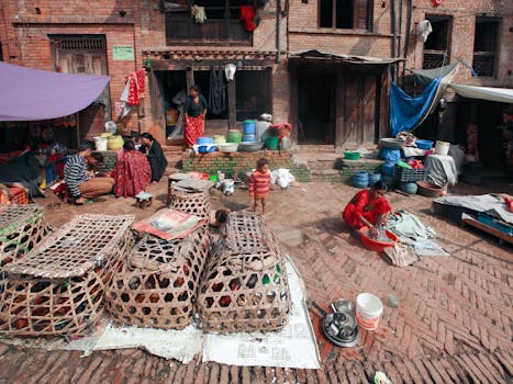 Vibrant rural market scene with people and traditional woven baskets outdoors.