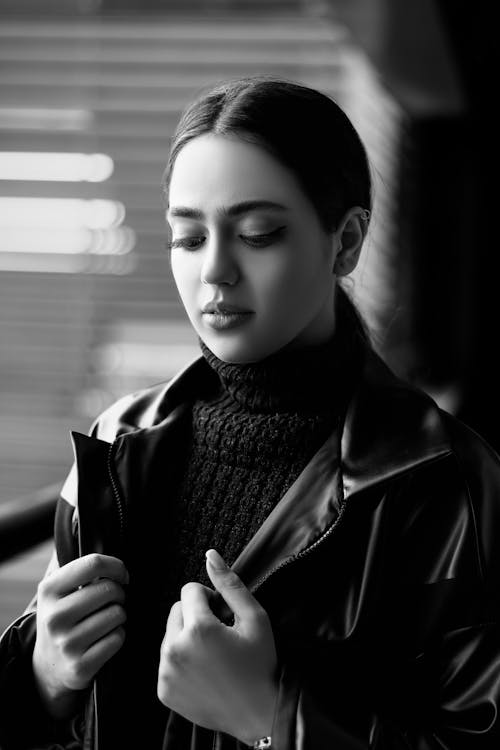 Grayscale Portrait of a Woman in a Leather Jacket