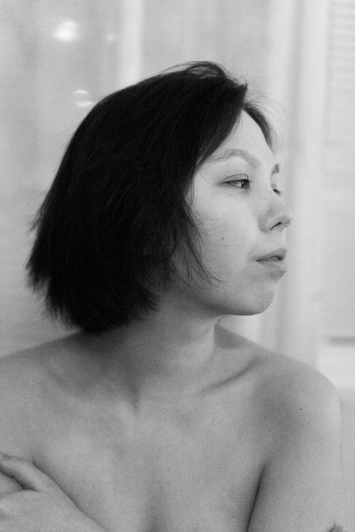 Free Striking grayscale portrait of a woman looking sideways, showcasing natural beauty. Stock Photo