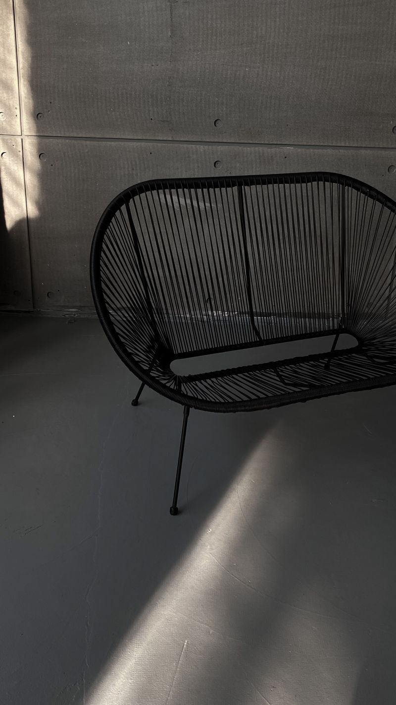 Metal frame chair construction showing tube joints and weld points