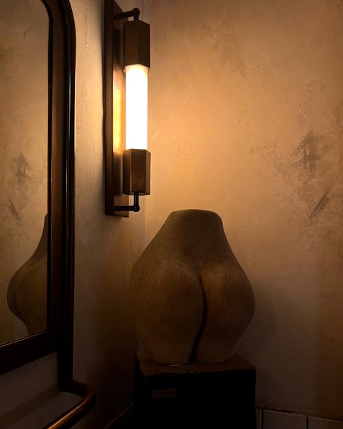 Free An Illuminated Wall Mounted Lamp Stock Photo