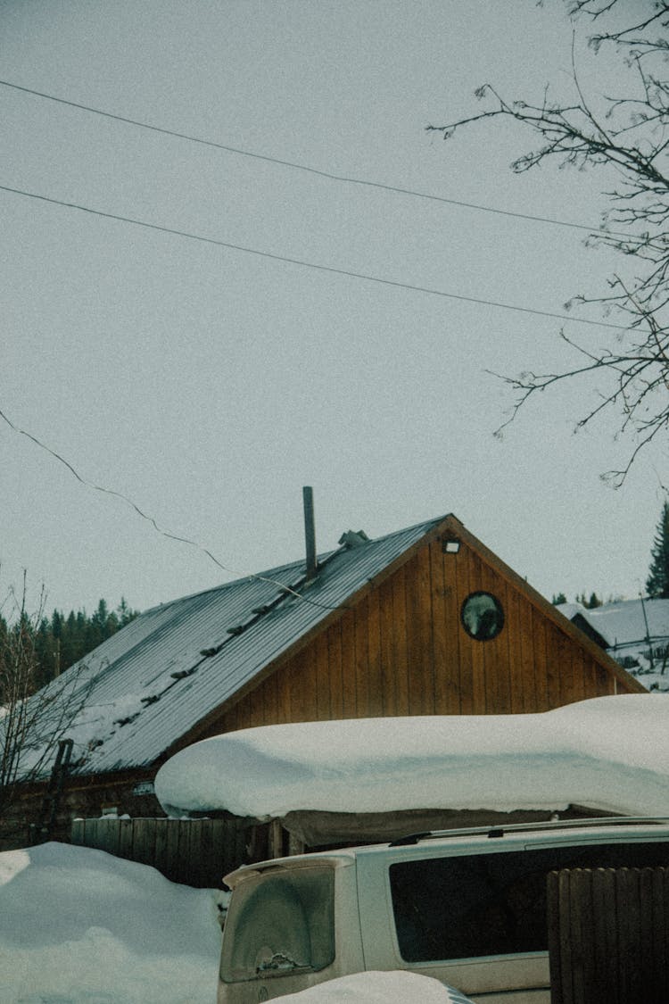 Brown Wooden House On Snow Covered Ground