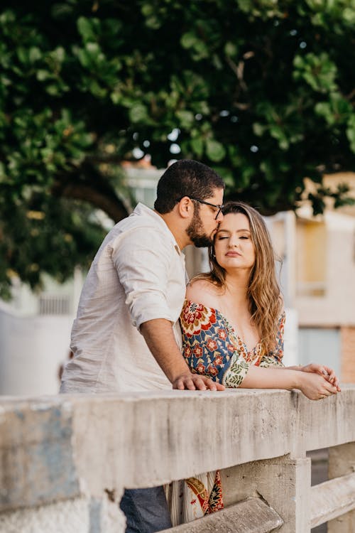 Free A Man Kissing a Woman while Her Eyes are Closed Stock Photo