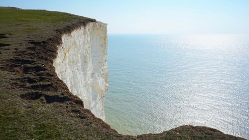 Free Breathtaking view of the iconic white cliffs in Eastbourne, England, meeting the vast sea. Stock Photo