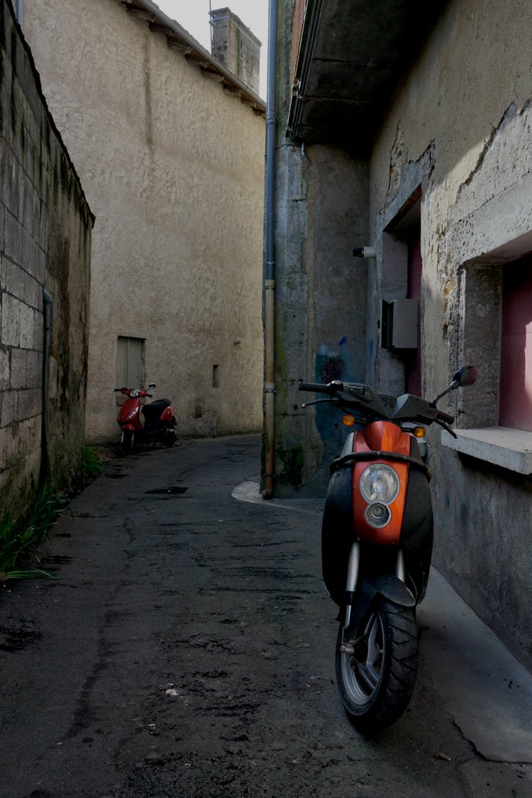 Black And Orange Motorcycle Parked On Street