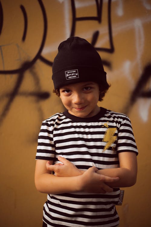Free Boy in Black and White Striped Crew Neck T-shirt Wearing Black Cap Stock Photo