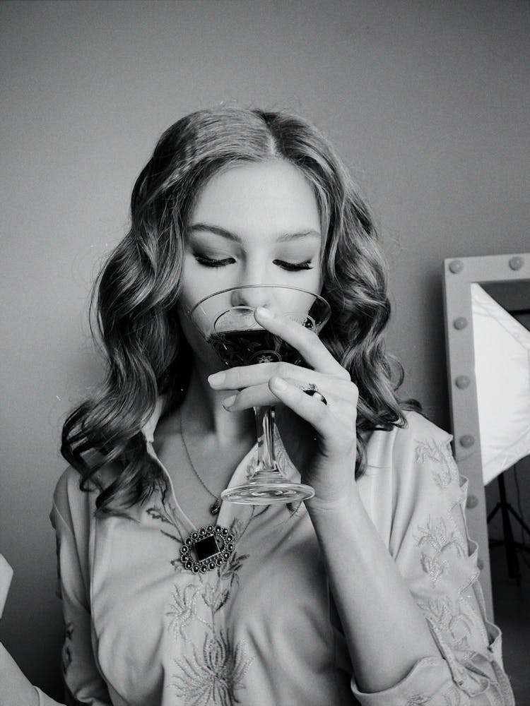 Portrait Of Woman Drinking From Martini Glass