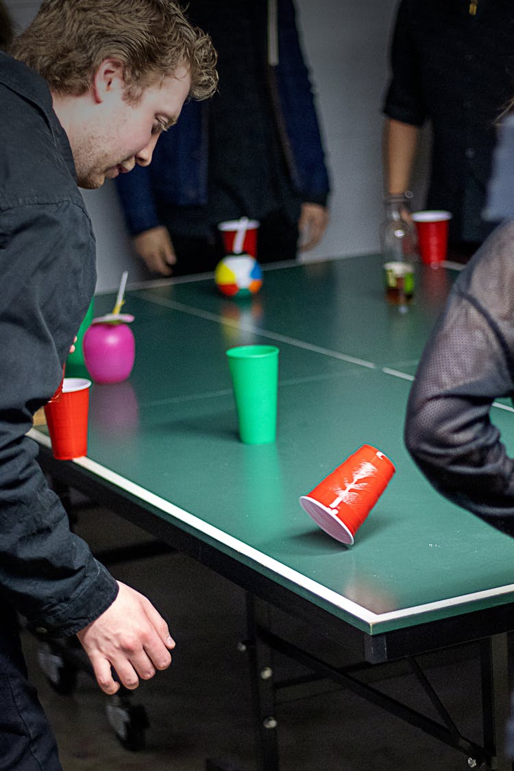 Man Playing Flip Cup