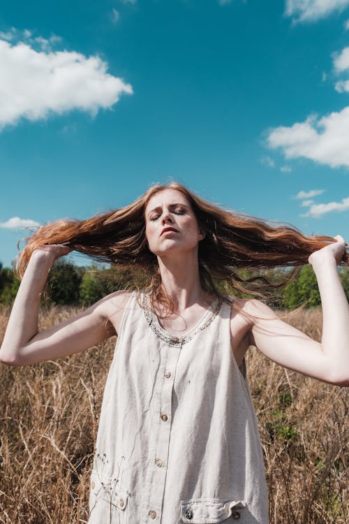 Free Beautiful Woman holding her Hair  Stock Photo