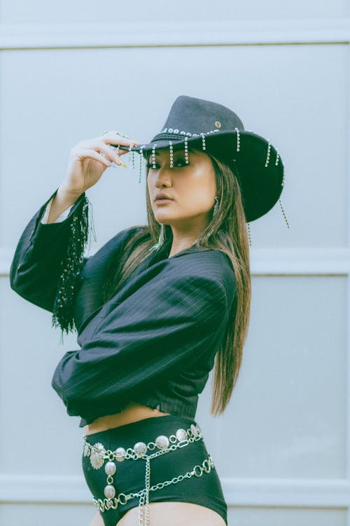 A Woman in Black Blazer Wearing Black Hat