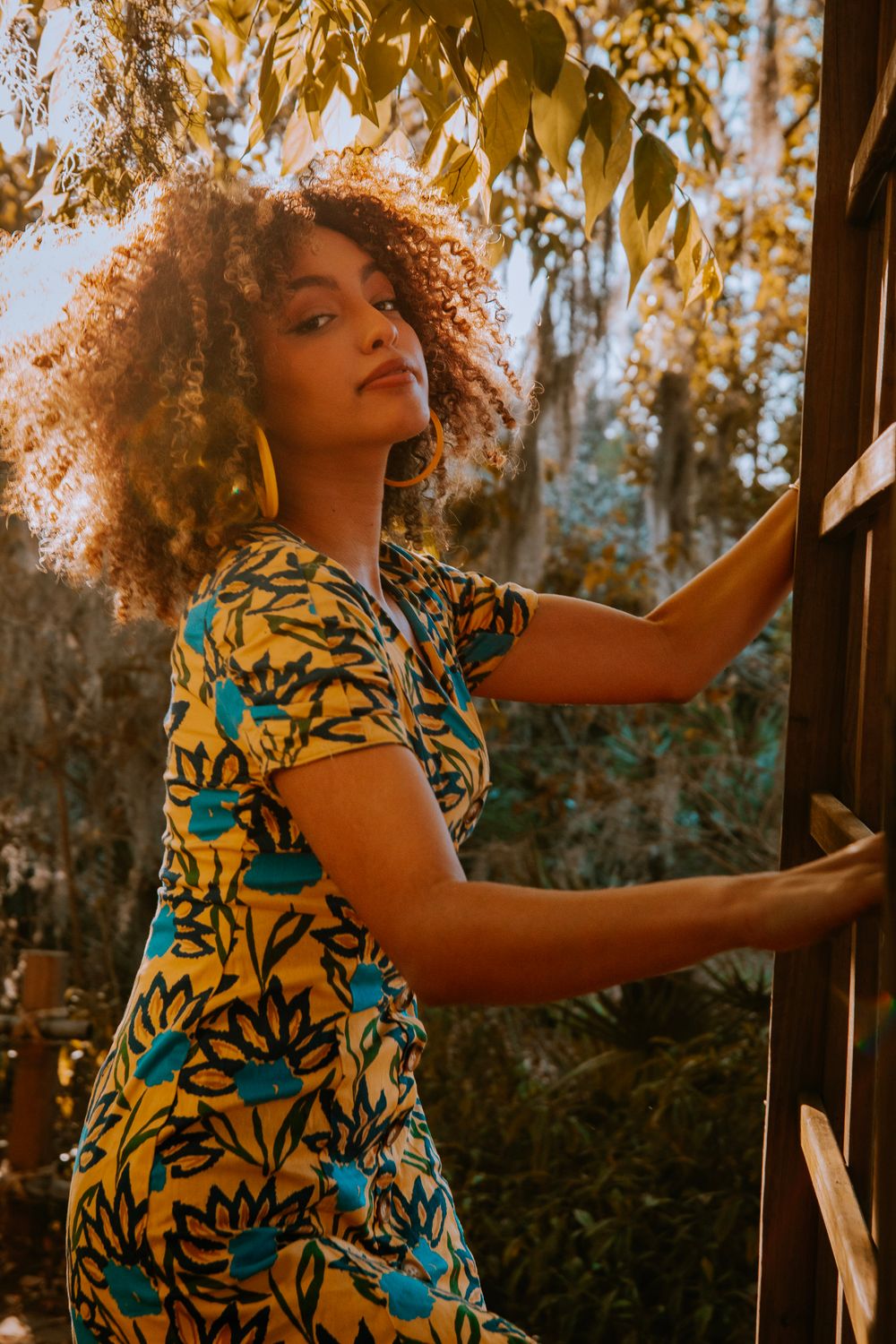 A Woman in Black and Yellow Floral Dress · Free Stock Photo
