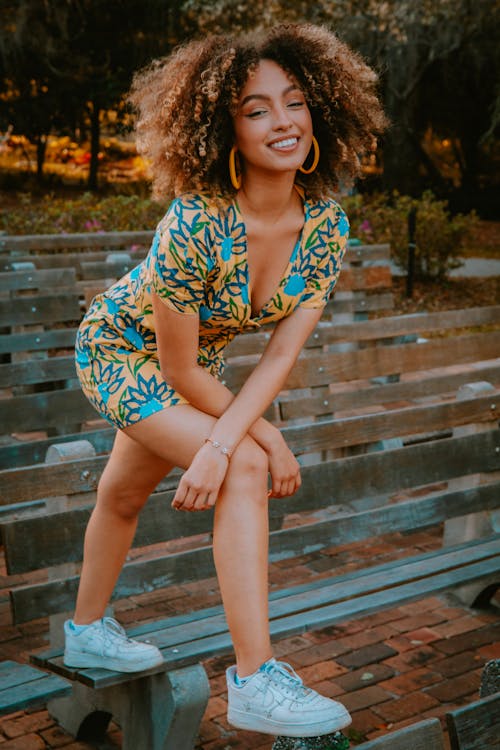 Woman in Yellow and Blue Floral Dress