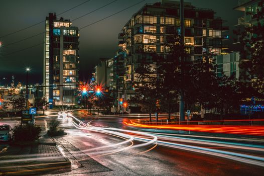 Long exposure of city lights and traffic in North Vancouver at night, showcasing urban life.