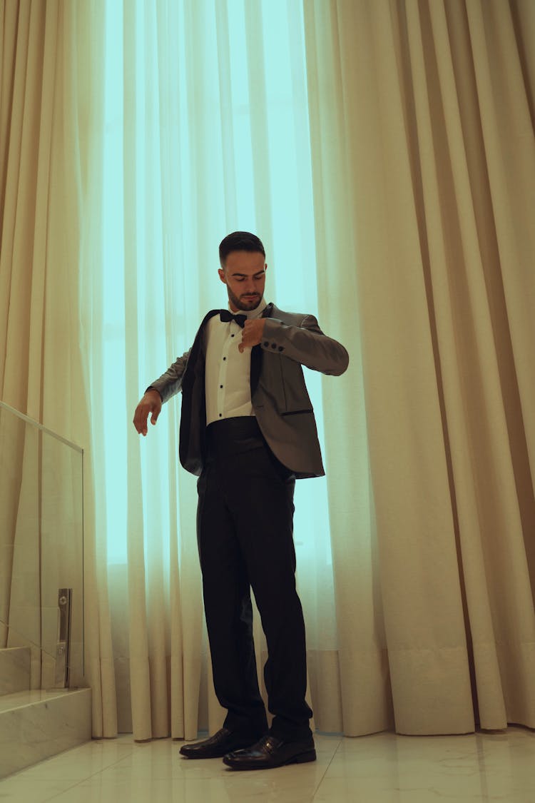 Man In Suit Looking At Watch