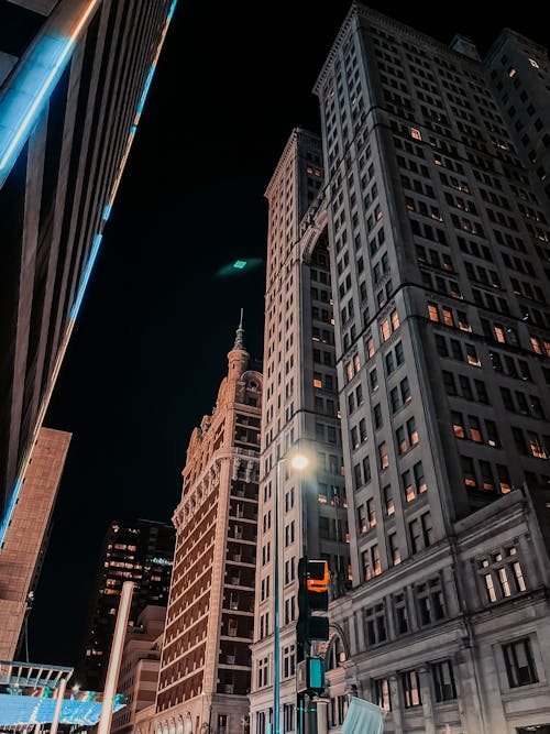 Low-Angle Shot of High-Rise Buildings during the Night