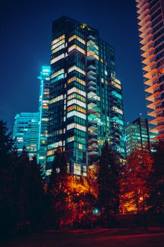 Stunning night view of Vancouver's illuminated skyline featuring modern architecture and vibrant colors.