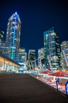 Stunning view of Vancouver's illuminated skyline at night, showcasing modern architecture.