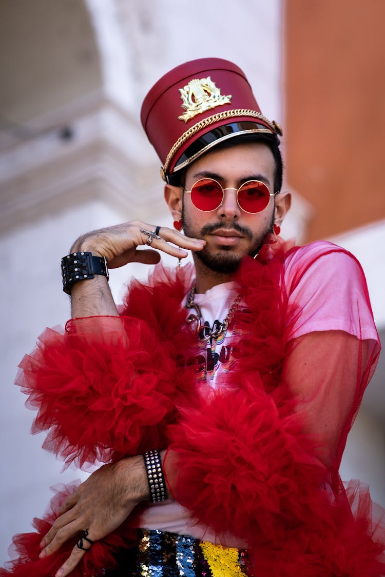 Man In Pink T-Shirt And Red Boa 