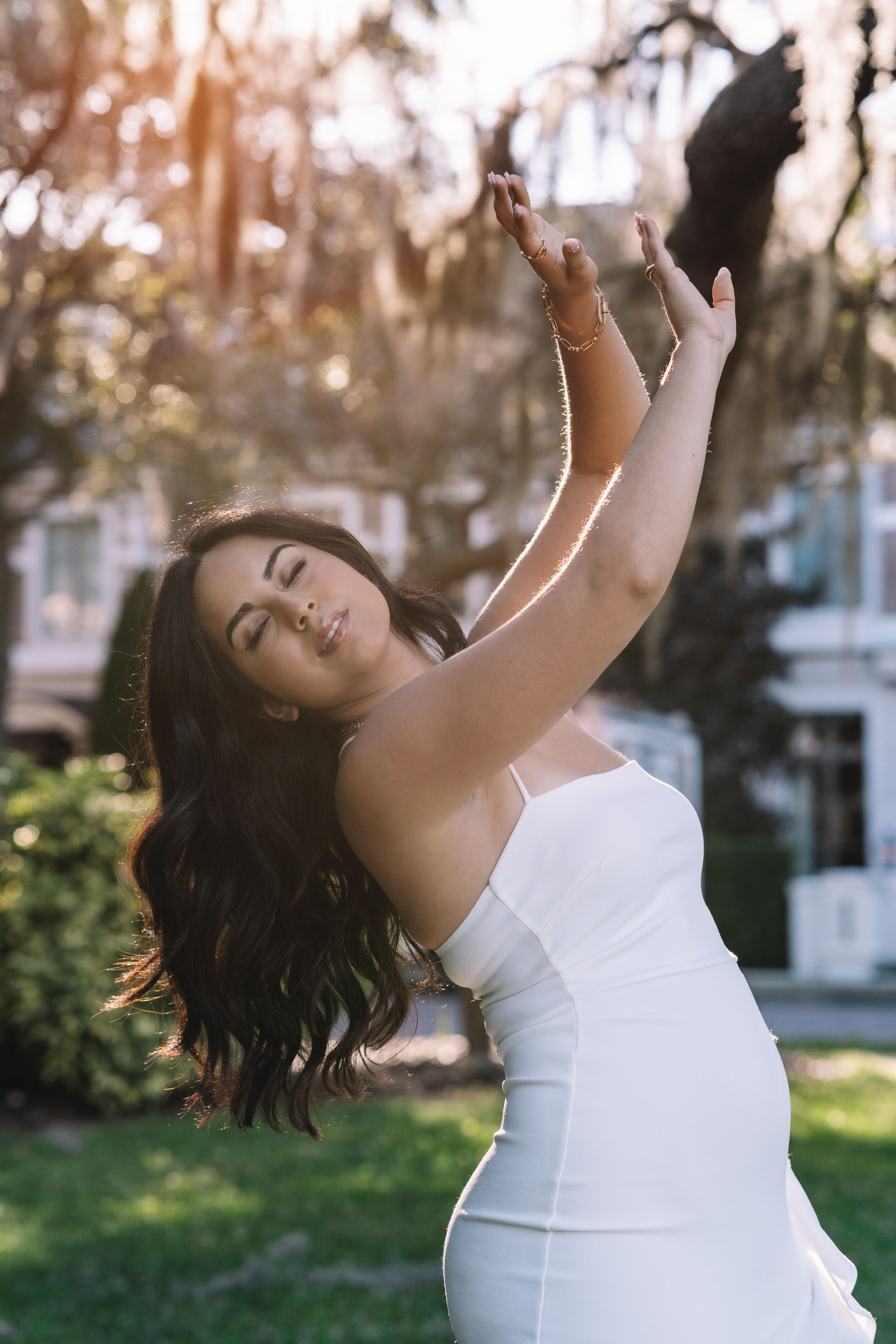 Woman in White Dress Raising Her Arm · Free Stock Photo