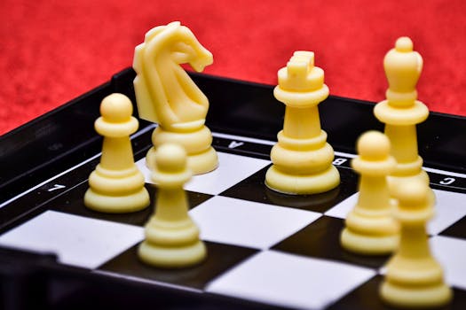 Close-up view of a chessboard with yellow pieces poised for strategic moves.