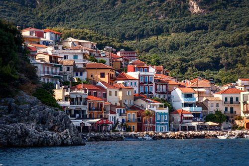 Free Vibrant houses on a rocky coast in a picturesque seaside town. Stock Photo