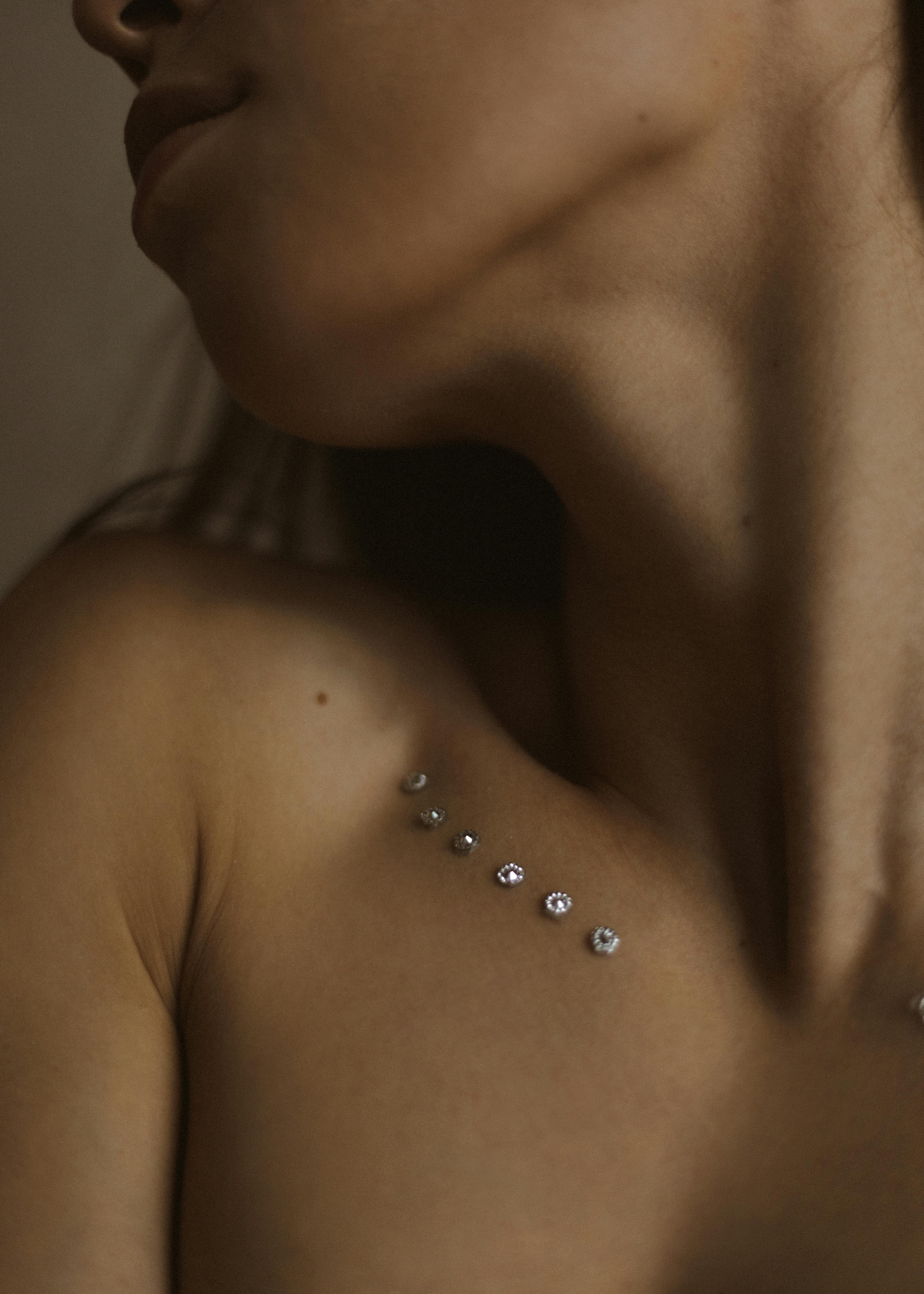 woman with rhinestones along her collarbone