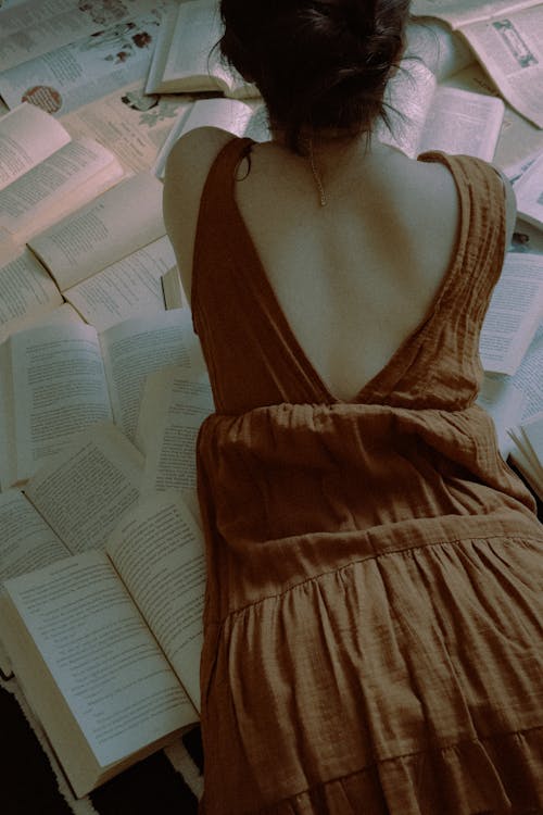 Back View of a Woman Reading a Book