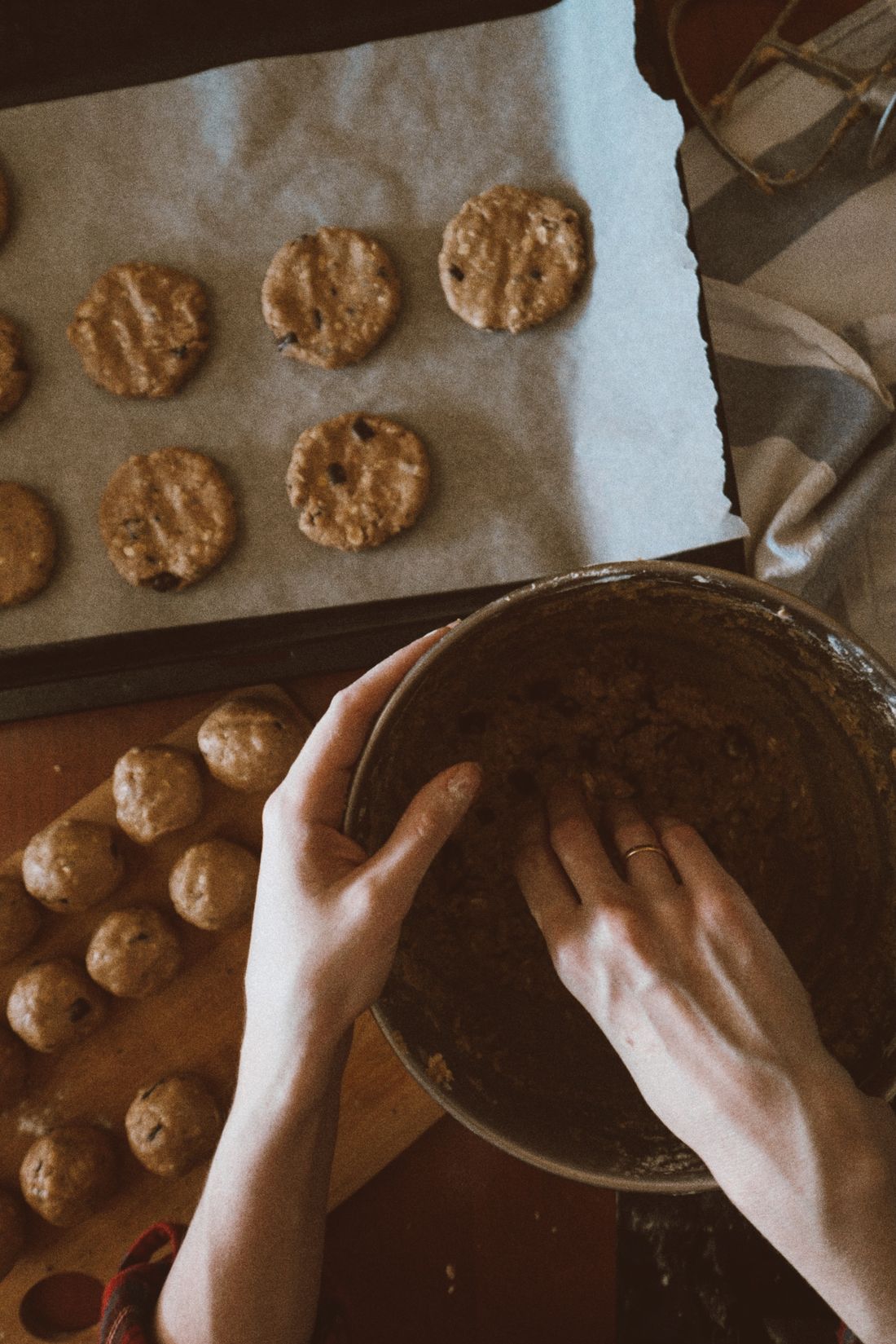 Hands mixing cookie dough