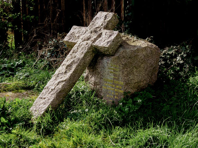 Gray Concrete Cross On Green Grass