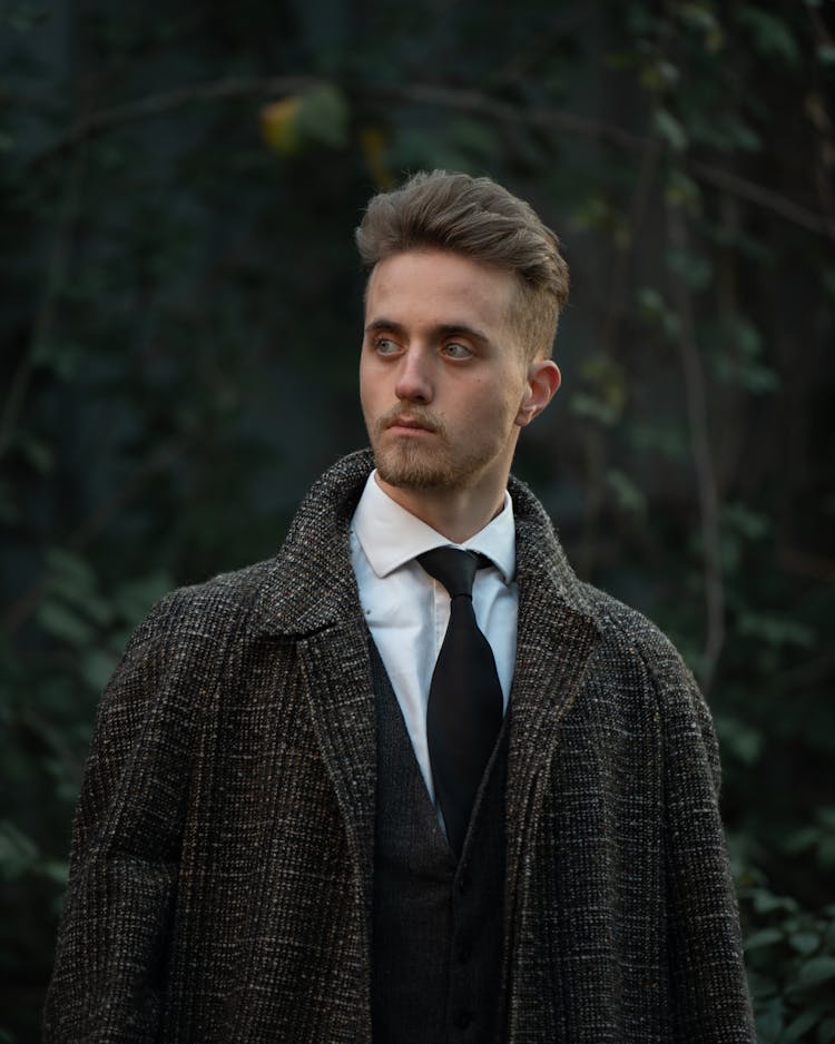 A Man Wearing A Tweed Coat