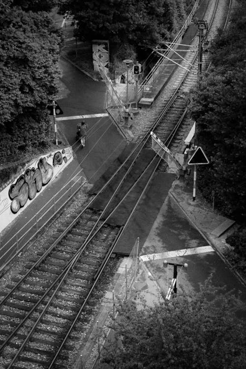 Grayscale Photo of a Train Railway