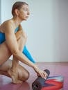 Woman Rolling Yoga Mat