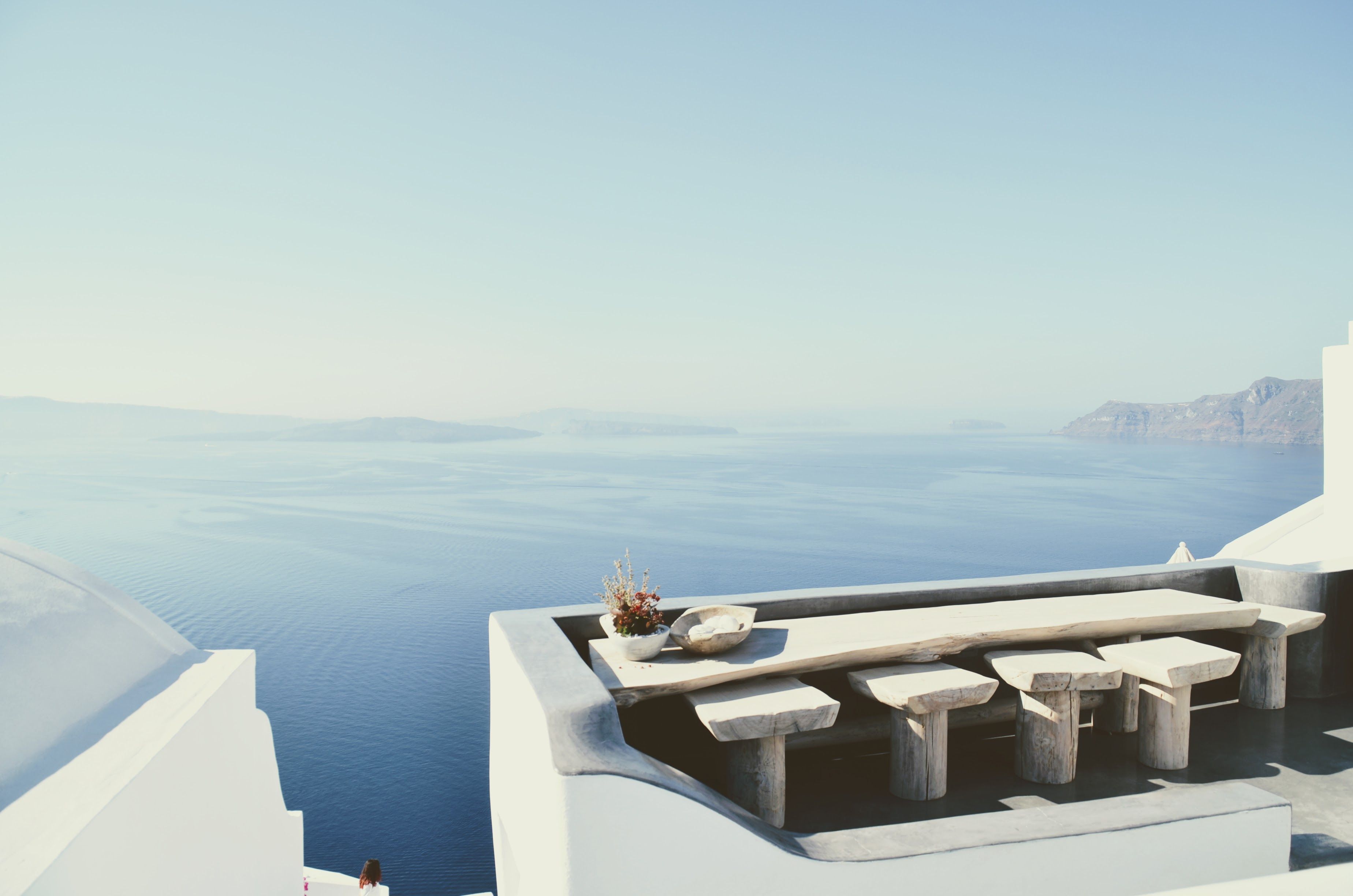 Private caldera-view honeymoon suite in Santorini in golden late-September light