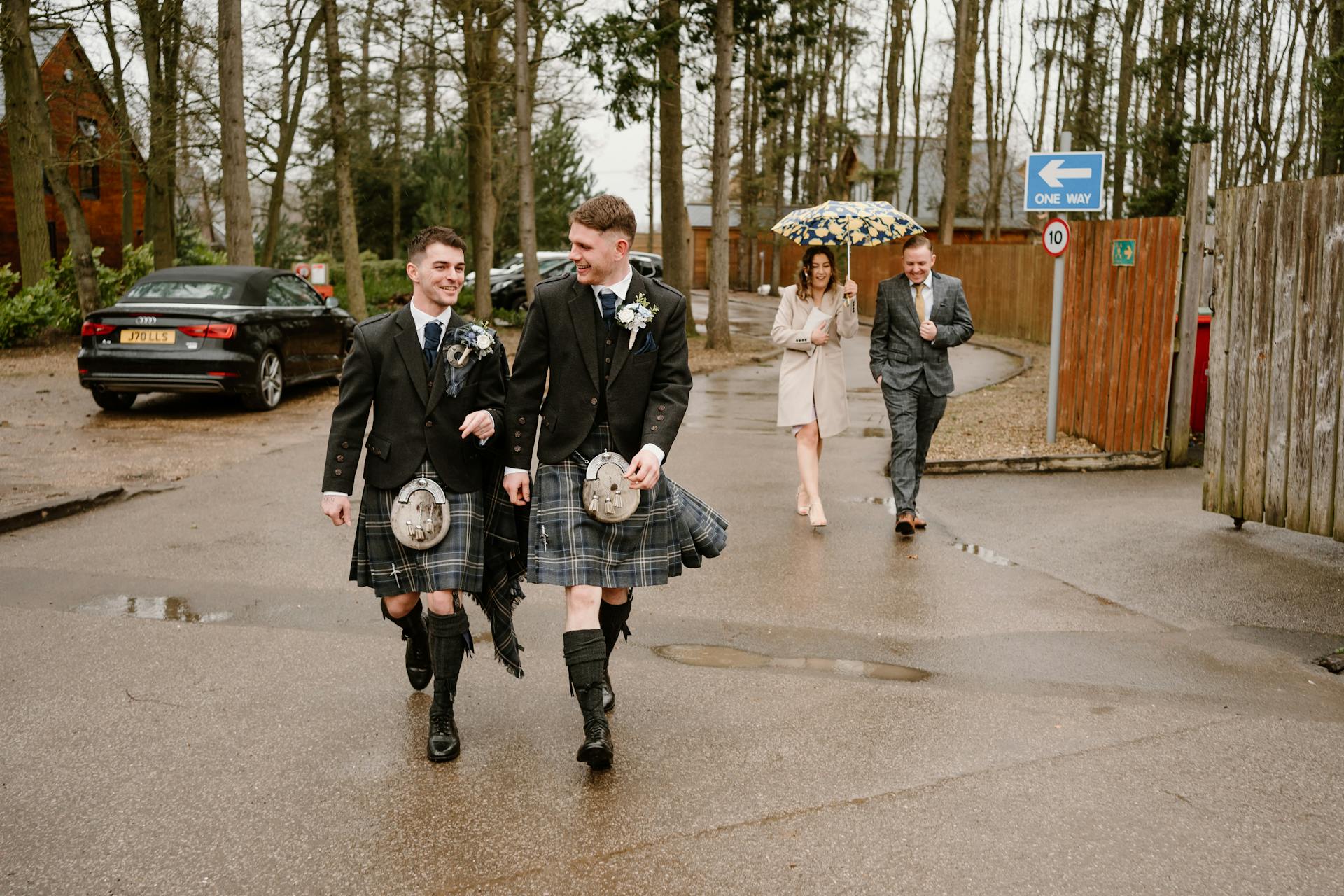 Men in Scottish Traditional Clothing Walking on Street