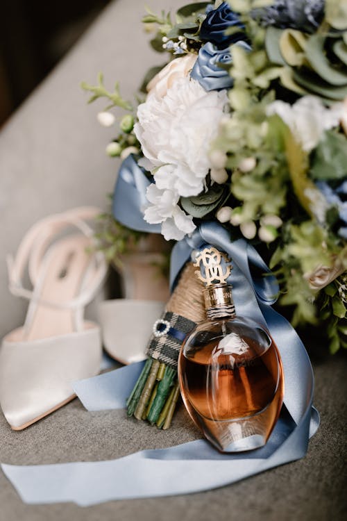 Free Bridal Bouquet and Perfume Bottle Stock Photo