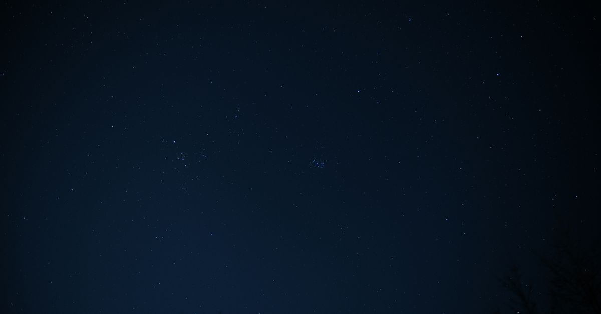 A serene view of a night sky filled with stars and constellations.