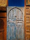 Blue Wooden Door With Gold Floral Door Lever