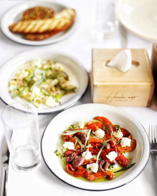 Free A beautifully arranged gourmet meal with fresh ingredients on a white table setting. Stock Photo