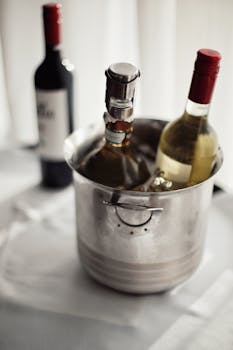 Close-up of wine bottles in an ice bucket, perfect for parties and events.