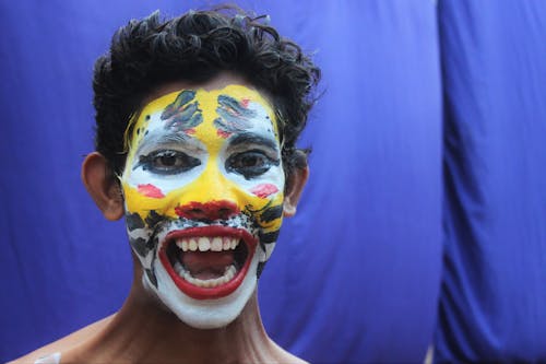 Close Up Photo of a Man with Face Paint