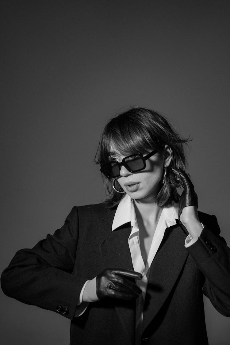 Woman Wearing Sunglasses Jacket And Leather Gloves 