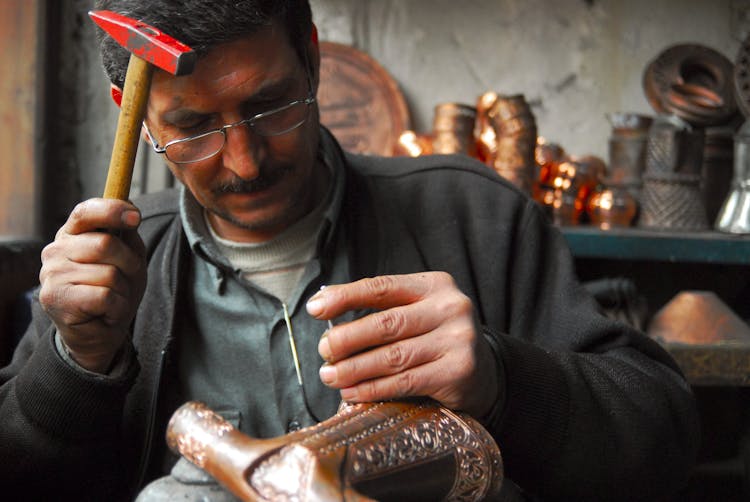 A Man Holding A Hammer