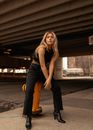 Beautiful Woman Sitting on a Hydrant 