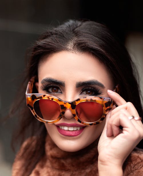 Free A Woman Wearing Sunglasses Stock Photo